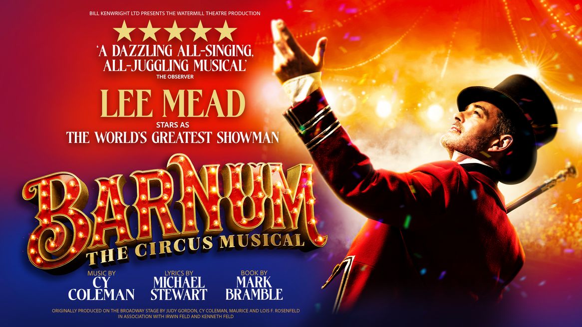 Lee Mead wears a red ringmaster's coat and a top hat as he looks out at a busy circus