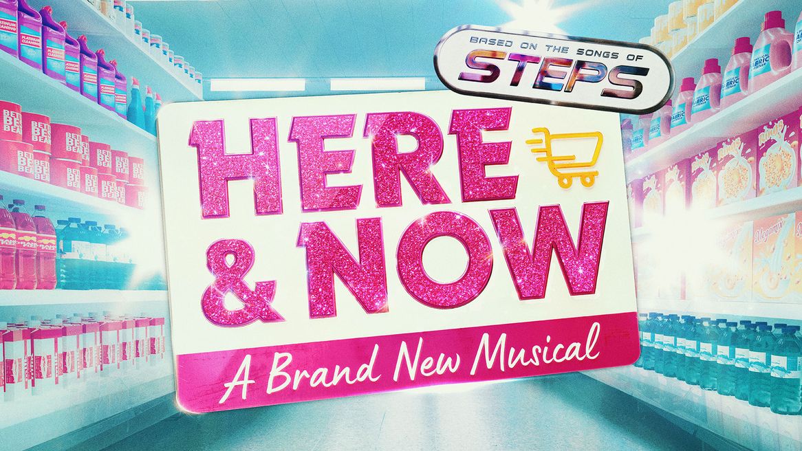 The words Here & Now in pink glittery letters in front of a supermarket aisle