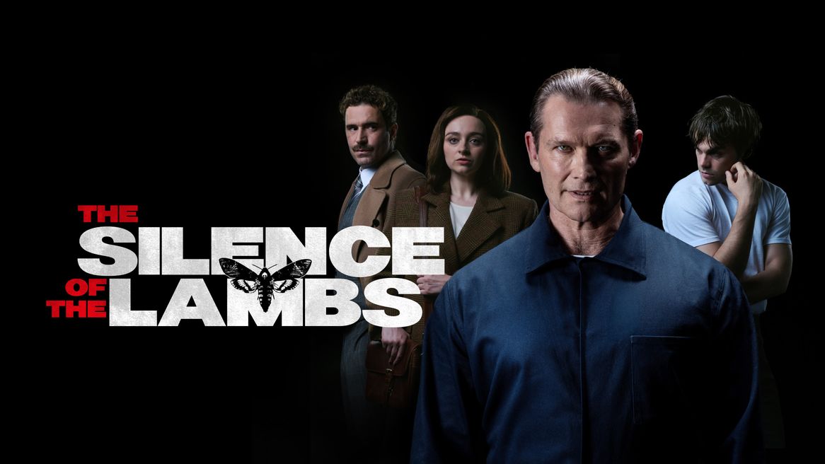 A man in a blue boiler suit stares sinisterly in front of a young female detective, a male detective and a shifty man