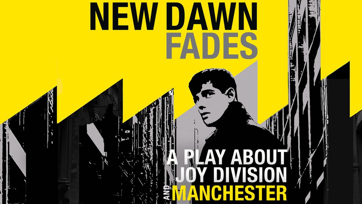 A man looks over his shoulder on a Manchester street