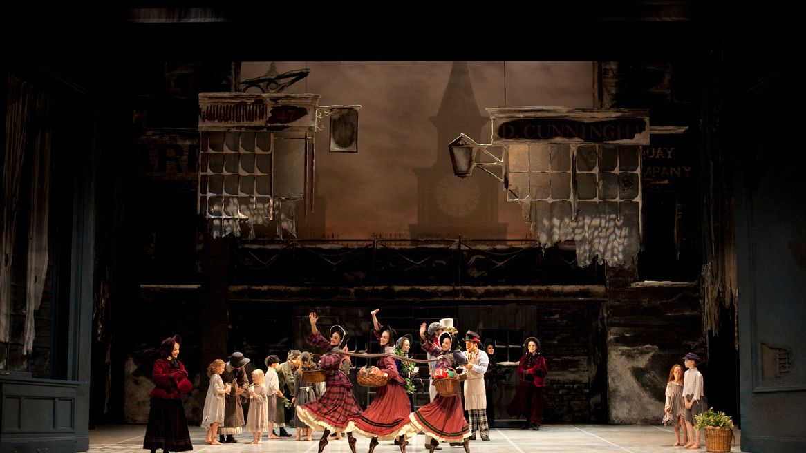 Ladies of the cast of Scrooge dancing on the stage