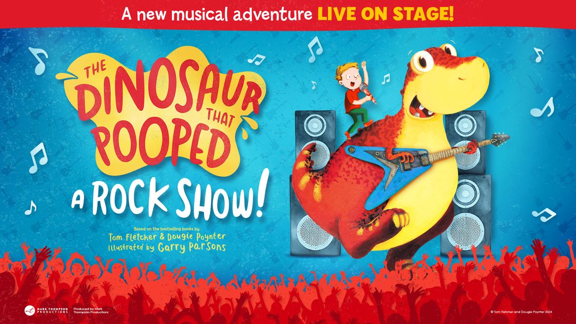 A little boy sings into a microphone as he rides on the back of a guitar playing dinosaur