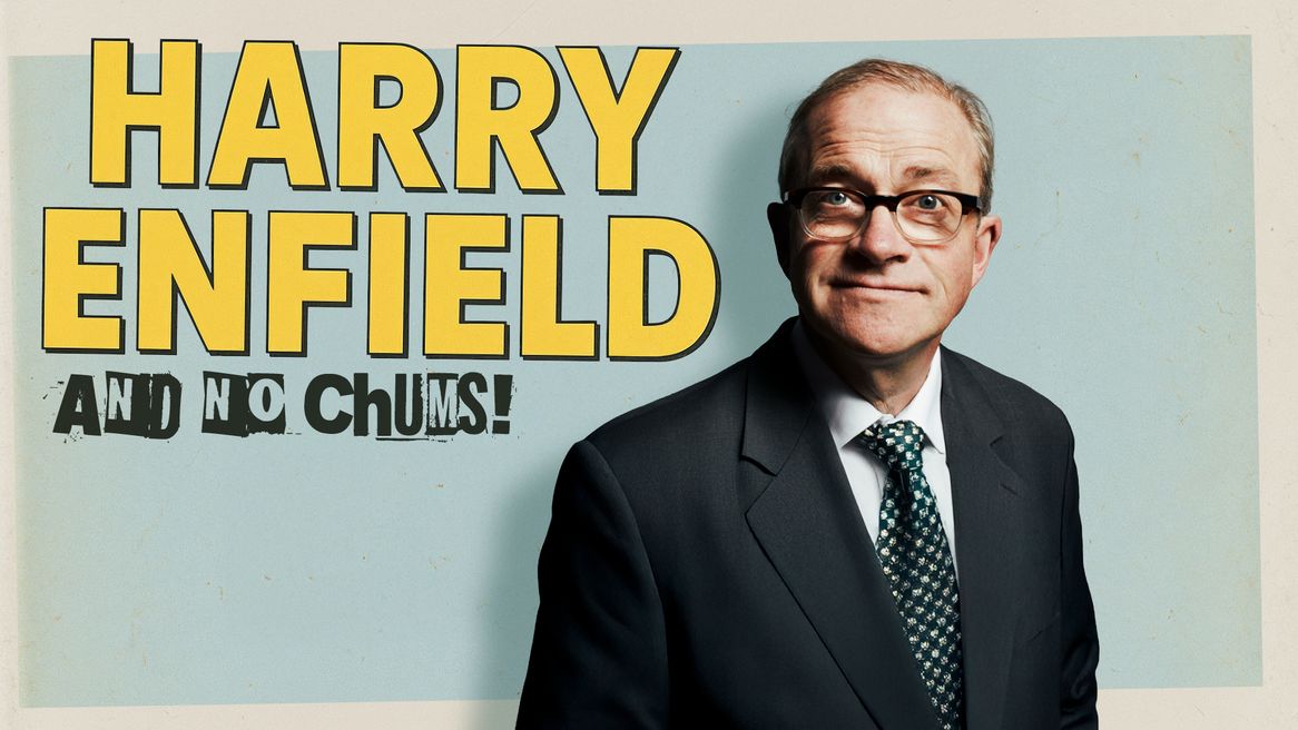 Harry Enfield wearing a suit and glasses in front of the words Harry Enfield and No Chums! 
