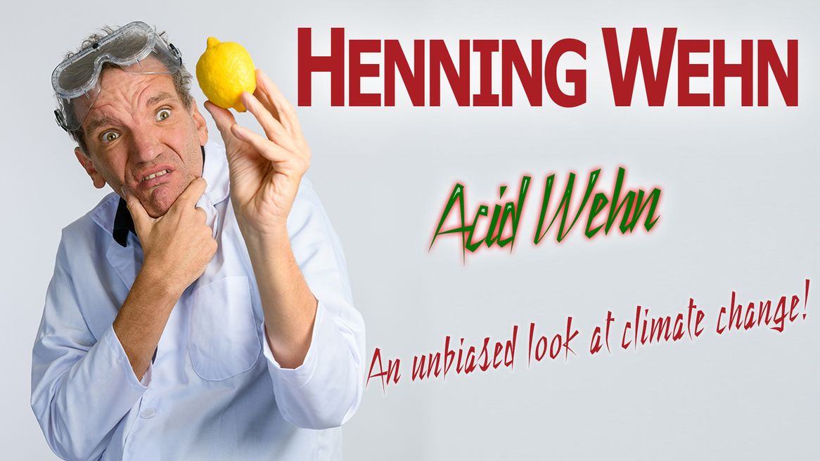 Comedian Henning Wehn wearing plastic goggles looking at a lemon with the the logo Acid When