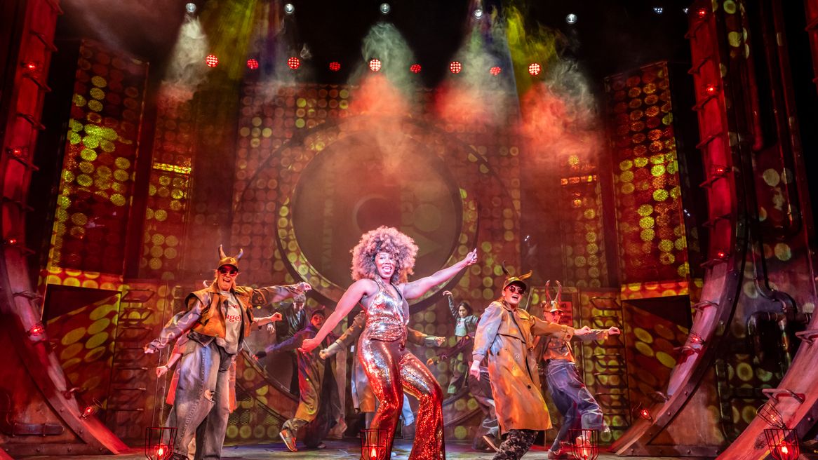 The cast of Lighning Theif with horned hats dancing a 
