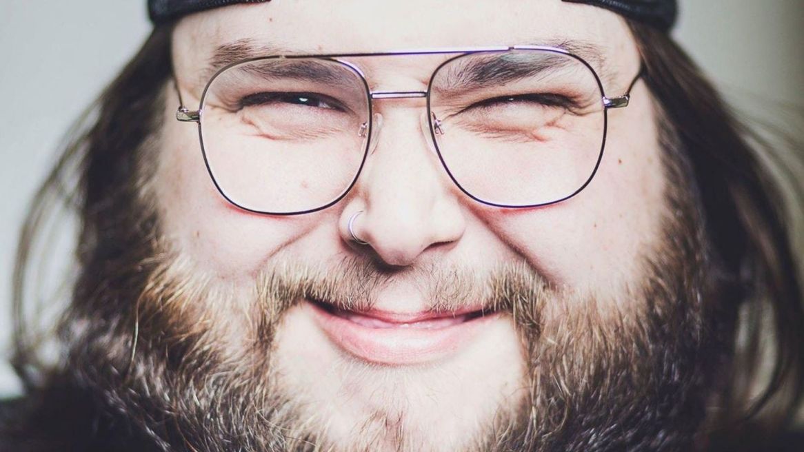 Headshot of MC Jed Salisbury grinning