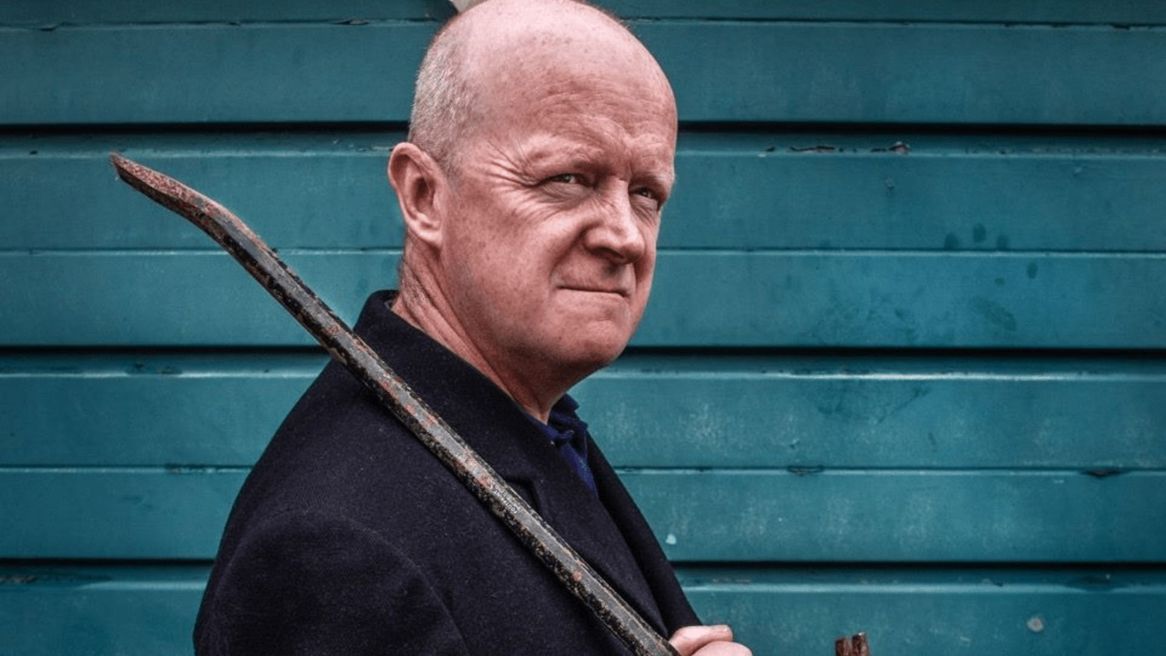 Comedian Mad Ron with a walking stick