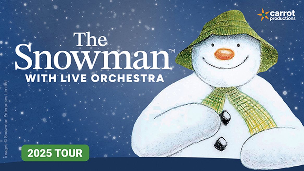 A snowman in a green hat and a green scarf smiles